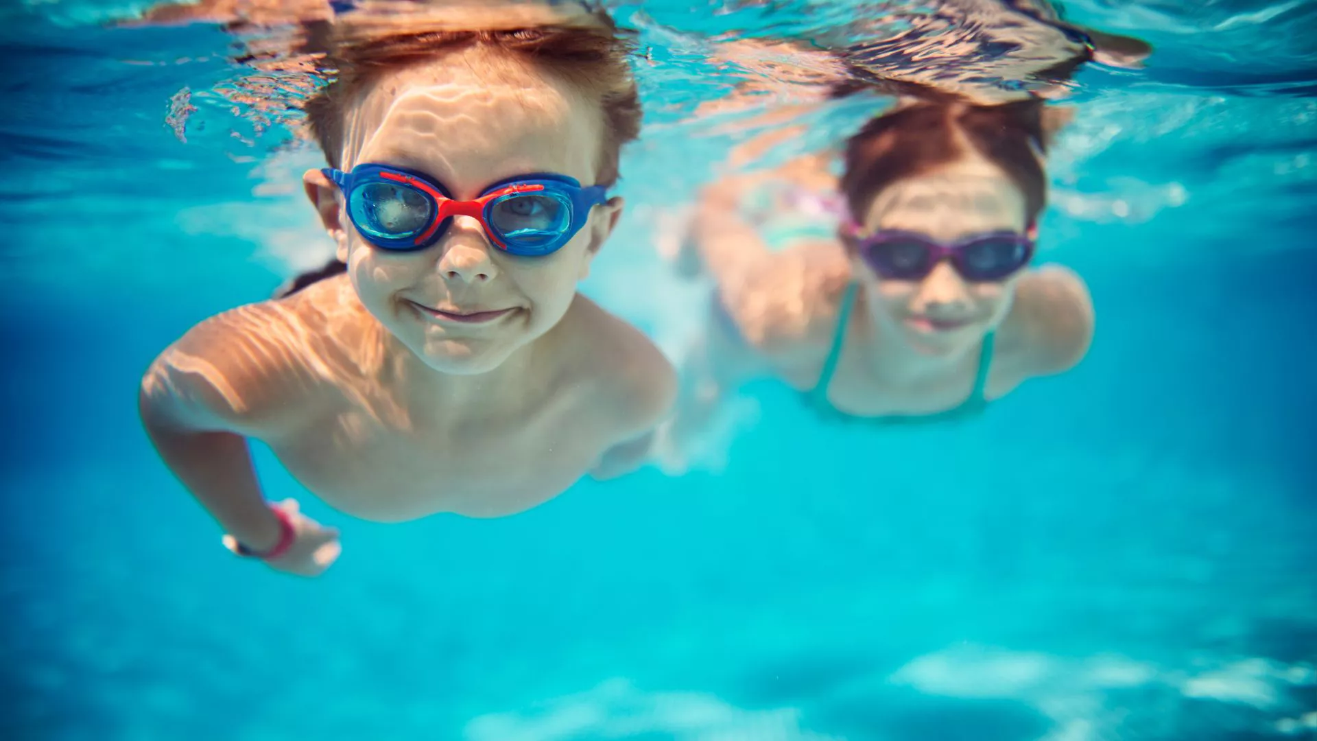 kids swimming under water shot